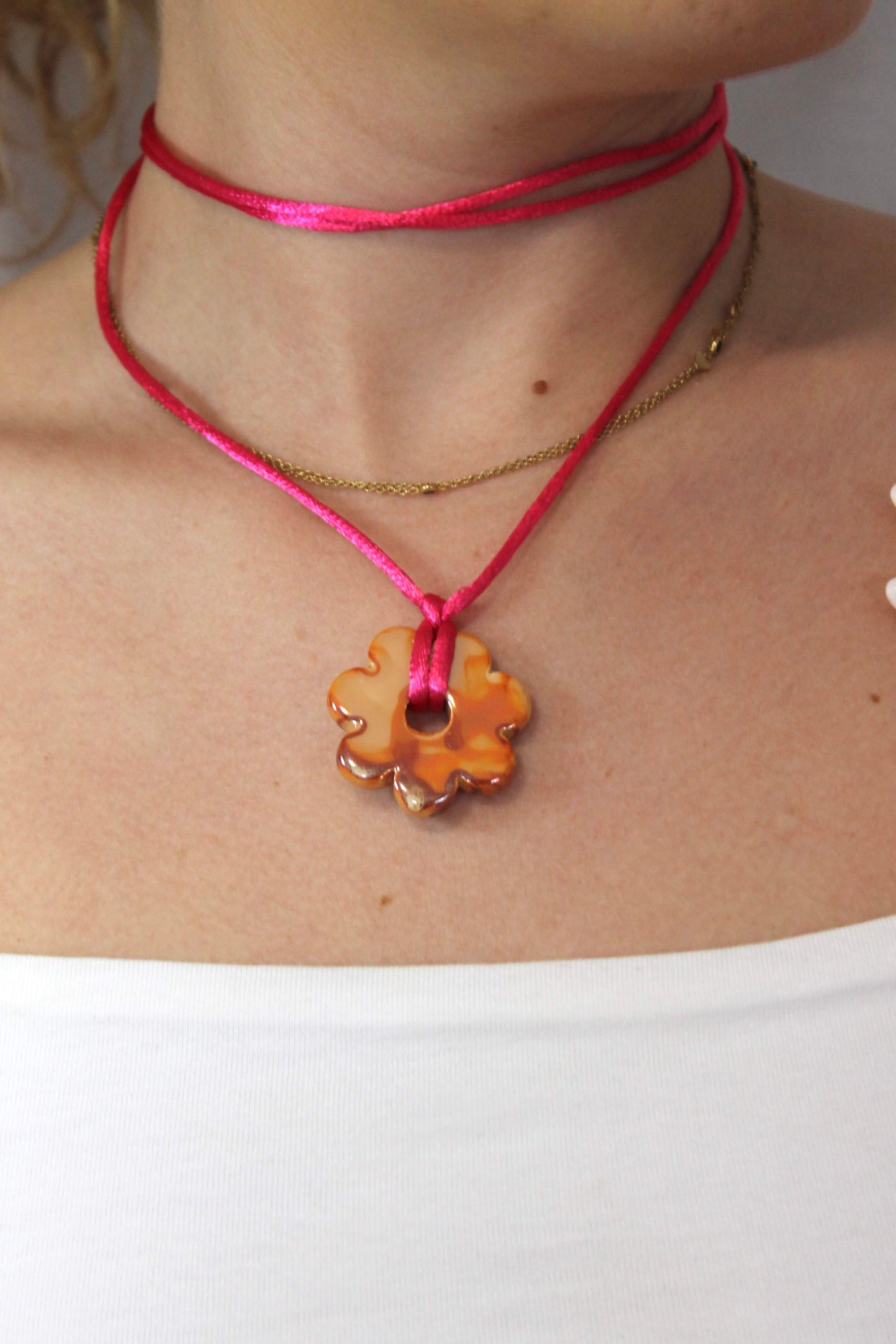 collar multiposicion naranja y rosa