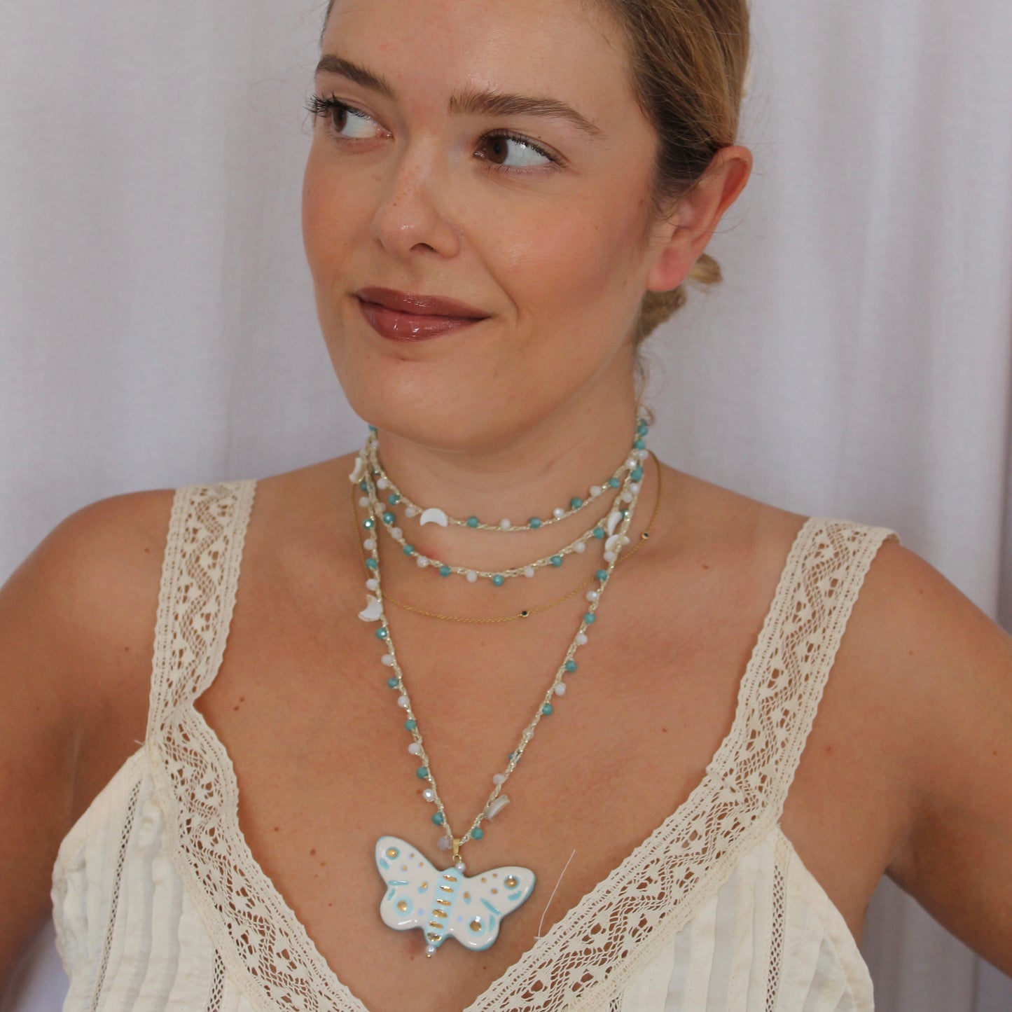 Collar mariposa turquesa
