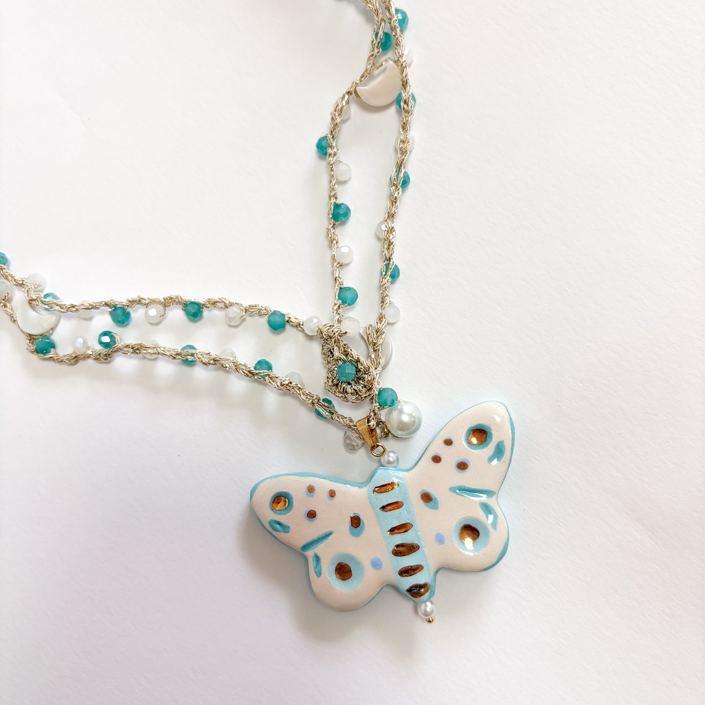 Collar mariposa turquesa