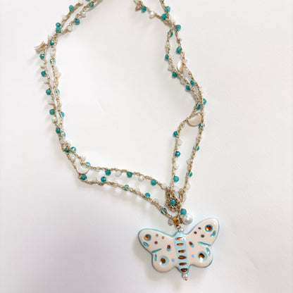 Collar mariposa turquesa